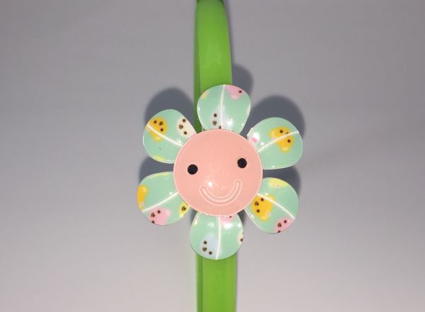 Head band with patterned flower shape