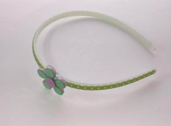 Polka dots patterned headband with flower shape