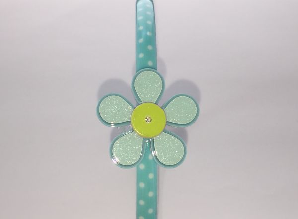 Polka dots patterned headband with flower shape