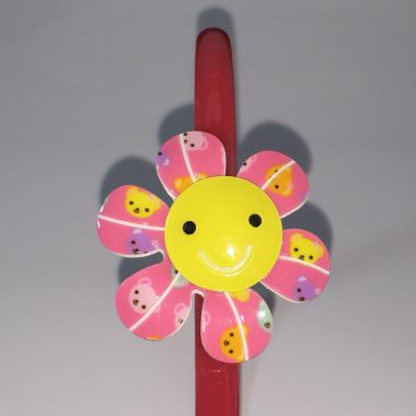 Head band with patterned flower shape