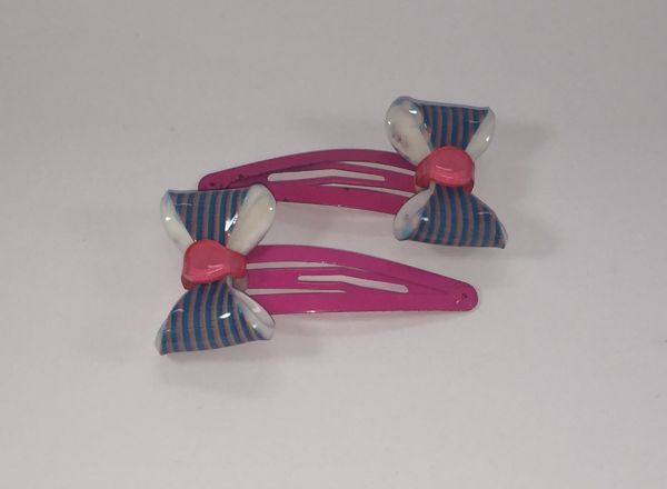 Snap clip with patterned bow
