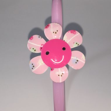 Head band with patterned flower shape