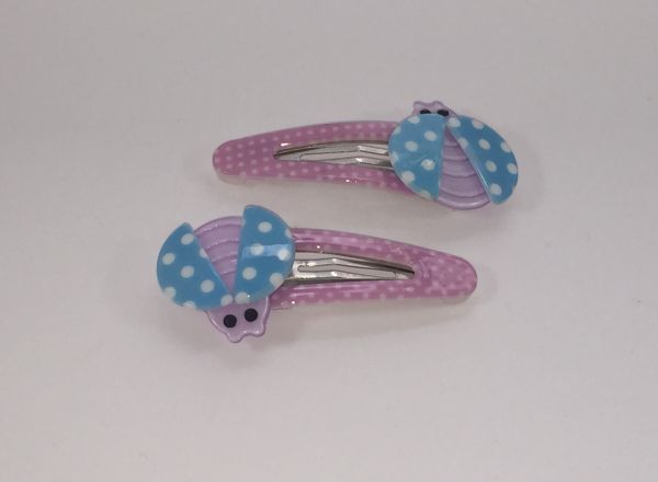 Patterned snap clip with ladybird