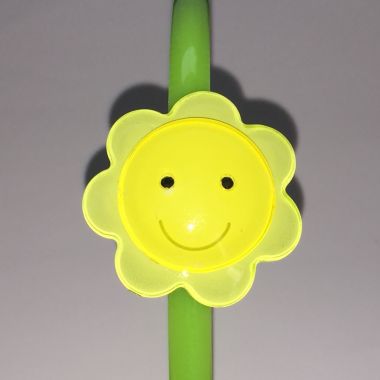 Head band with face patterned flower