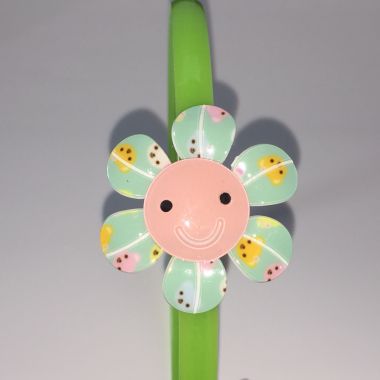 Head band with patterned flower shape