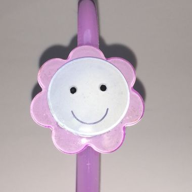 Head band with face patterned flower