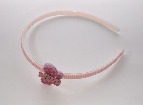 Patterned head band with butterfly shape