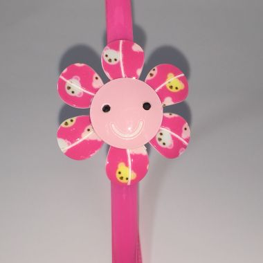 Head band with patterned flower shape